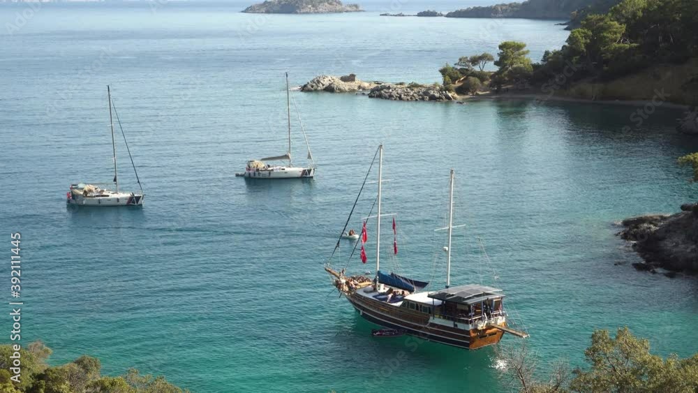 Sailing yacht stay in dream bay with turquoise transparent water mediterranean sea Sailing yacht stay in dream bay with turquoise transparent water mediterranean sea