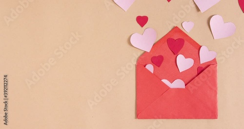 Stop motion animation with hearts getting out of envelope. Copy space. Love, valentine day, mothers day greeting card concept
