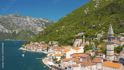 Perast, Montenegro. Aerial top view of the cityscape and St. Nicholas Church 