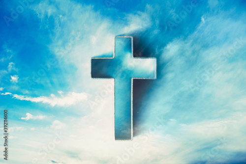 Photography Shining cross in clouds on blue sky