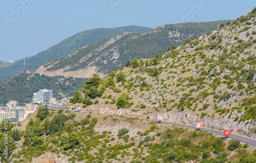Highway in the mountains. Rafailovici resort. Budva Riviera. Montenegro. 09/14/2020. View of Rafailovichi resort from Chelobrdo mountain. Mount Tolpish. Aerial view of the Budva Riviera.
