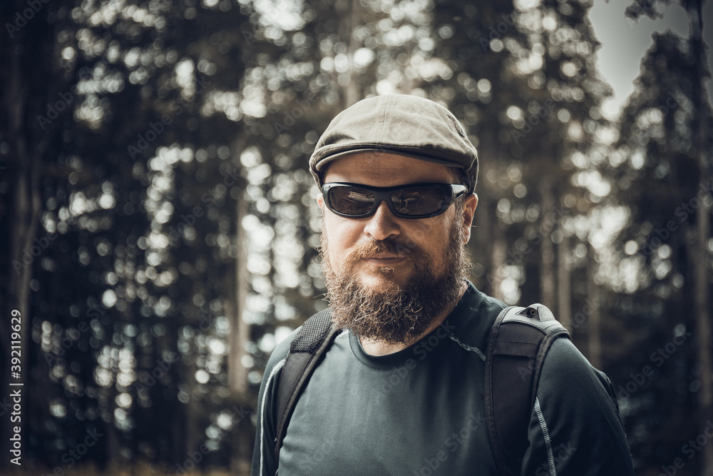 Solid bearded man in sunglasses and cap Solid bearded man in sunglasses and cap