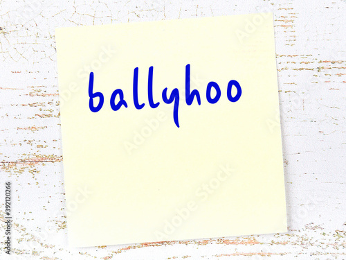 Yellow sheet of paper with word ballyhoo. Reminder concept photo