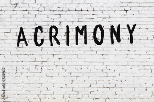 Tablou pe pânză White wall with black paint inscription acrimony on it