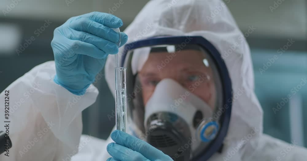 crime expert is researching chemical in test tube in chemistry laboratory, portrait of male scientist crime expert is researching chemical in test tube in chemistry laboratory, portrait of male scientist