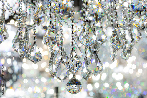 Closeup of cristal chandelier. Beautiful diamonds chandelier for home decoration  Concept about objects and jewelry. 