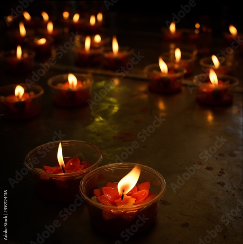 candles in the dark for buddhist celebration or christmas