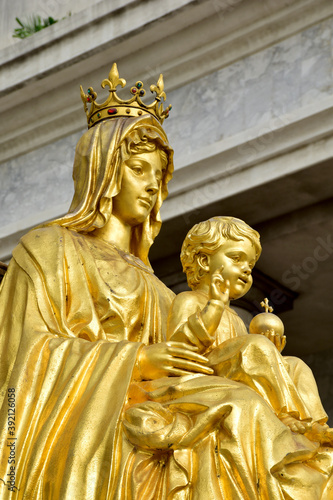 Statue gold Our Lady of Grace Virgin Mary with Child Jesus in the church, Thailand. selective focus.