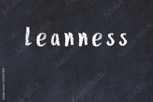 College chalk desk with the word leanness written on in