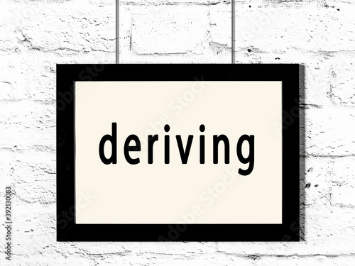 Φωτογραφία Black frame hanging on white brick wall with inscription deriving