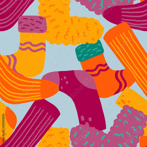Cute socks flat hand drawn vector seamless pattern. Colorful background in abstract, scandinavian style. Cozy winter clothes. Simple design for wallpaper, wrapping, textile, fabric, decor, print, card