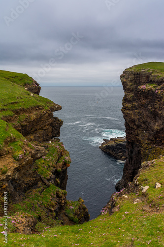 Eshaness Cliffs on the western coastline on Shetlands Mainland during a cloudy summer day