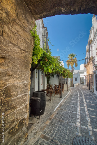 Typical street in Vejer de la Frontera, a beautiful town in the province of Cadiz, Andalusia, Spain photo
