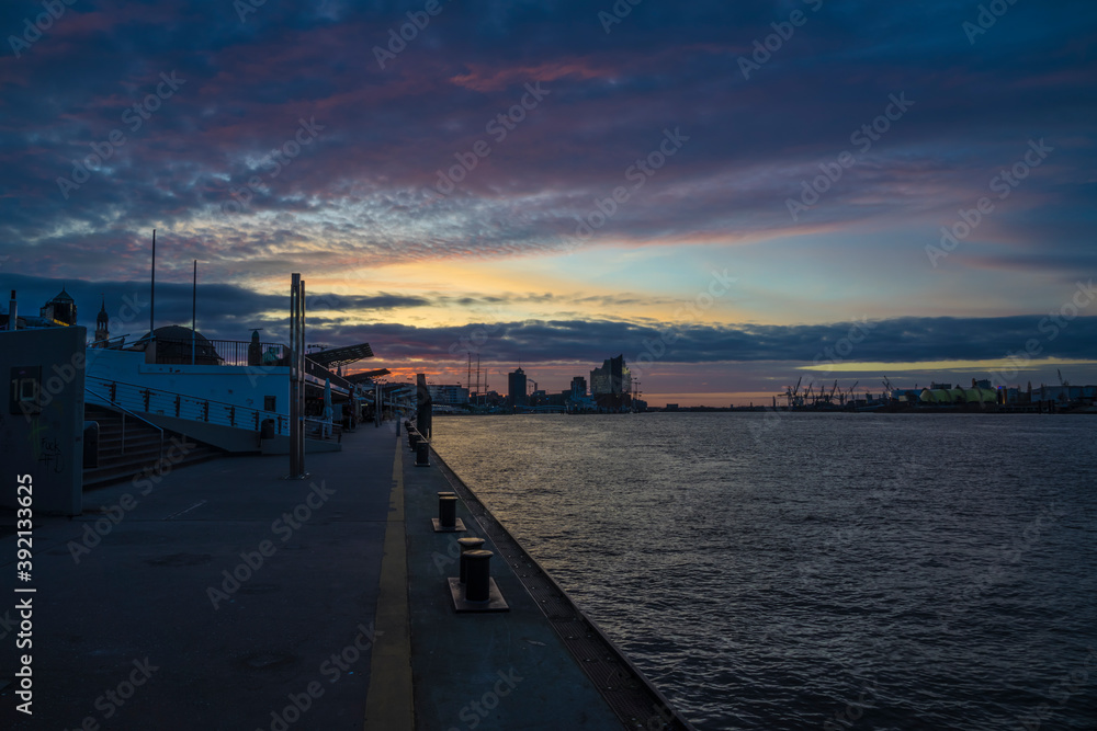 Sunrise in the harbor of Hamburg.