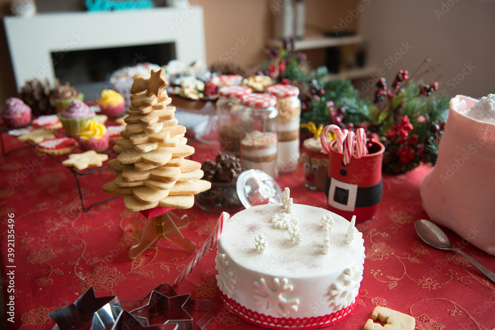 table set at home with a variety of Christmas products and food
