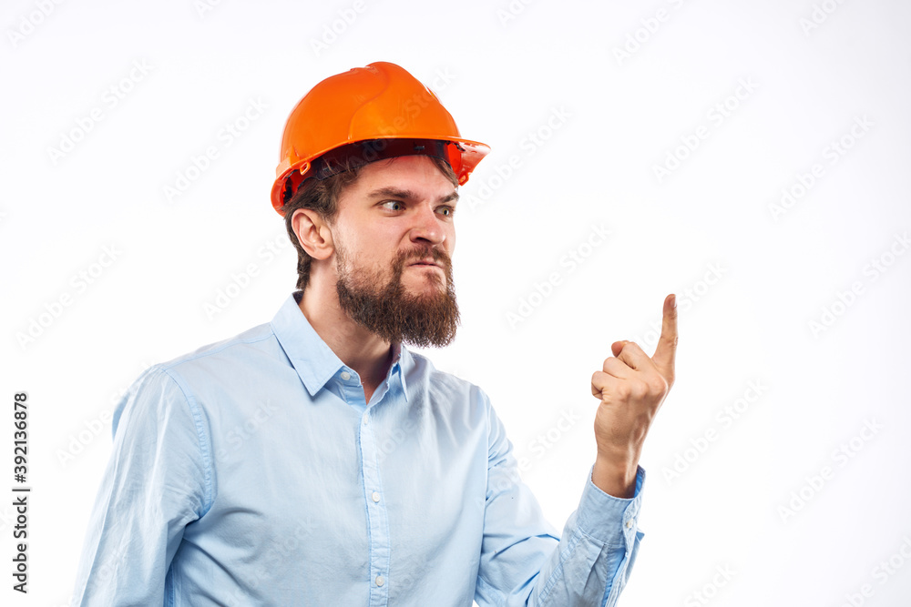 Angry man in orange hard hat industry work dissatisfaction cropped view