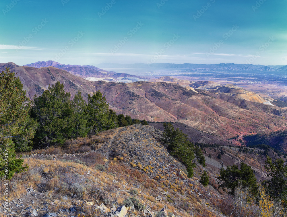 Obraz premium Butterfield Peak views of Oquirrh range toward Provo, Tooele, Utah Lake and Salt Lake County by Rio Tinto Bingham Copper Mine, in fall. Utah. United States.