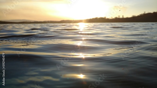 Sunset on waving waters