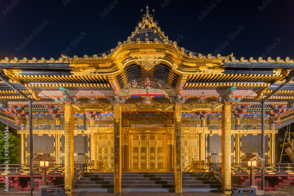 Front view of the golden Ueno Tōshō-gū temple covered of gold foils dedicated to Tokugawa Shoguns classed as Important cultural property in Ueno Park at night.