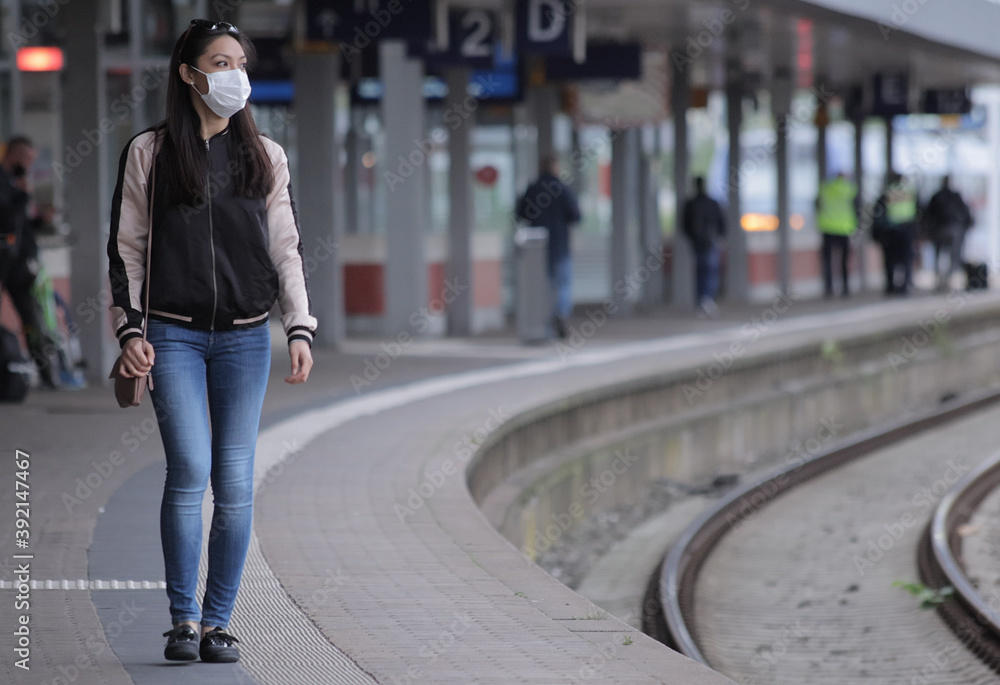 You have to wear face masks on the platform of a railway station - urban photography