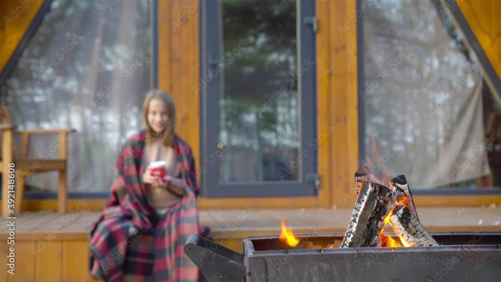 Beautiful girl wrapped in a blanket at autumn warm day Beautiful girl wrapped in a blanket at autumn warm day