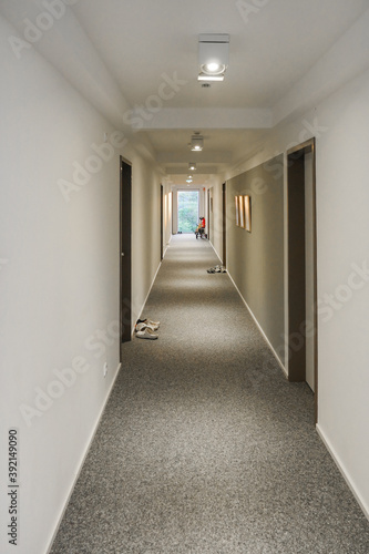 Long Building Corridor with Window at End