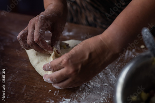 woman cooking traditional tatarian dish echpochmak photo