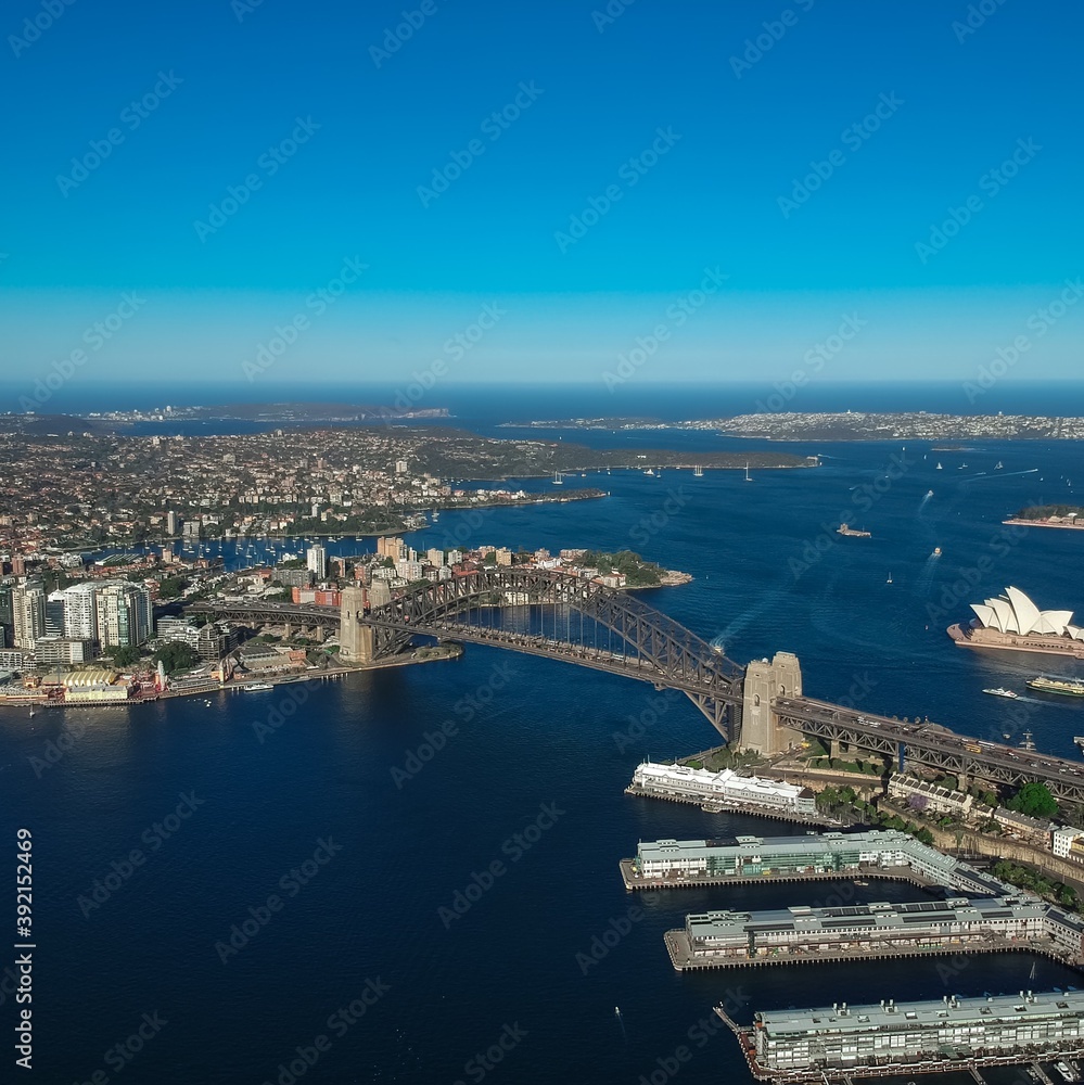 Fototapeta premium Panoramic Aerial views of Sydney Harbour with the bridge, CBD, North Sydney, Barangaroo, Lavender Bay and boats in view