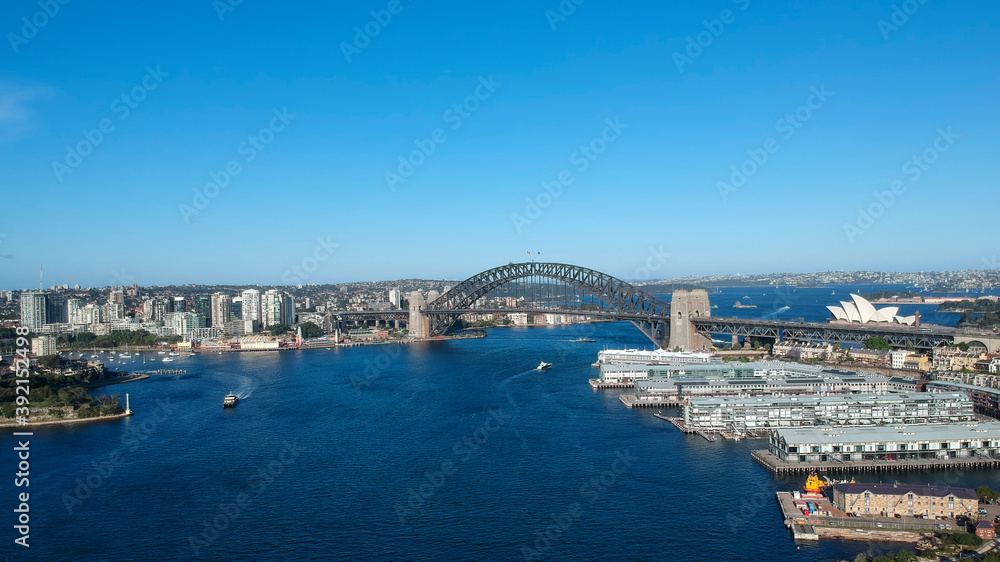 Panoramic Aerial views of Sydney Harbour with the bridge, CBD, North Sydney, Barangaroo, Lavender Bay and boats in view