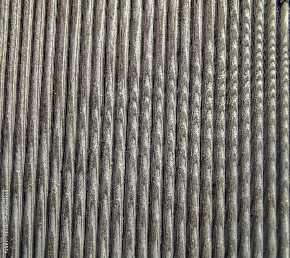 unusual radial pattern on a wooden old ribbed board photographed close-up. wood abstract background unusual radial pattern on a wooden old ribbed board photographed close-up. wood abstract background