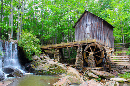An historic mill near Marietta with green leafs in late spring.	 photo