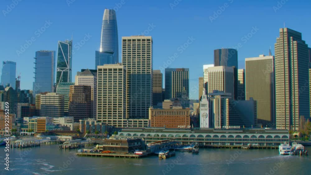 Aerial view of the San Francisco Ferry building with its clock tower. Famous buildings and piers. Financial District. Shot on Red weapon 8K. California, United States. Aerial view of the San Francisco Ferry building with its clock tower. Famous buildings and piers. Financial District. Shot on Red weapon 8K. California, United States.