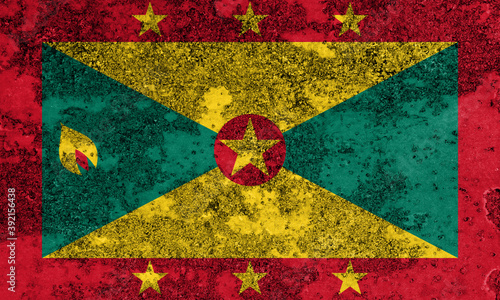 Flag of Grenada painted on the old grunge rustic iron surface. Abstract paint of Grenada national flag on the iron surface