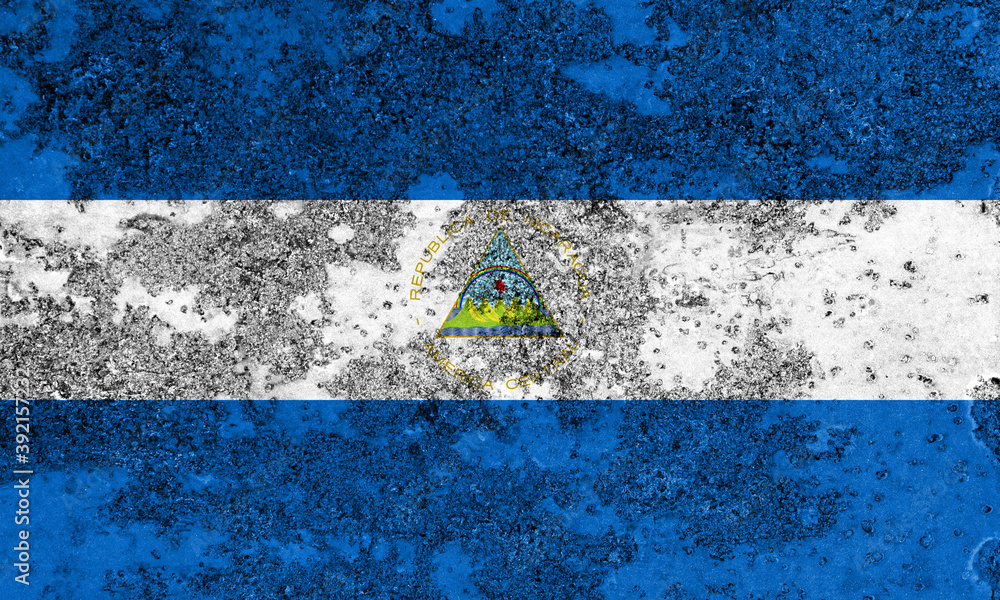 Flag of Nicaragua painted on the old grunge rustic iron surface. Abstract paint of Nicaragua national flag on the iron surface