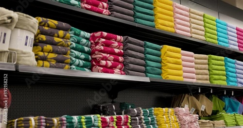 Shelf full of different colored covers in a shop in 4k photo