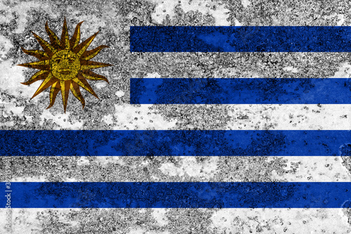 Flag of Uruguay painted on the old grunge rustic iron surface. Abstract paint of Uruguay national flag on the iron surface