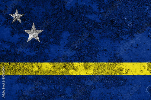 Flag of Curaçao painted on the old grunge rustic iron surface. Abstract paint of Curaçao national flag on the iron surface