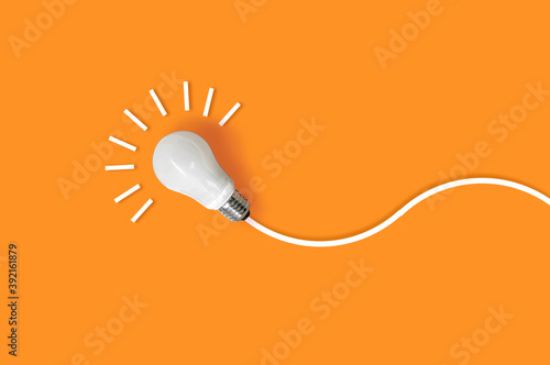 idea light bulb on orange background. creativity inspiration ,planning ideas concept photo