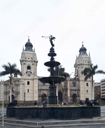 fountain in main square with foggy weather