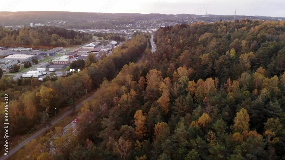 Sunset aerial drone flight over autumn forest towards Gothenburg city Sunset aerial drone flight over autumn forest towards Gothenburg city