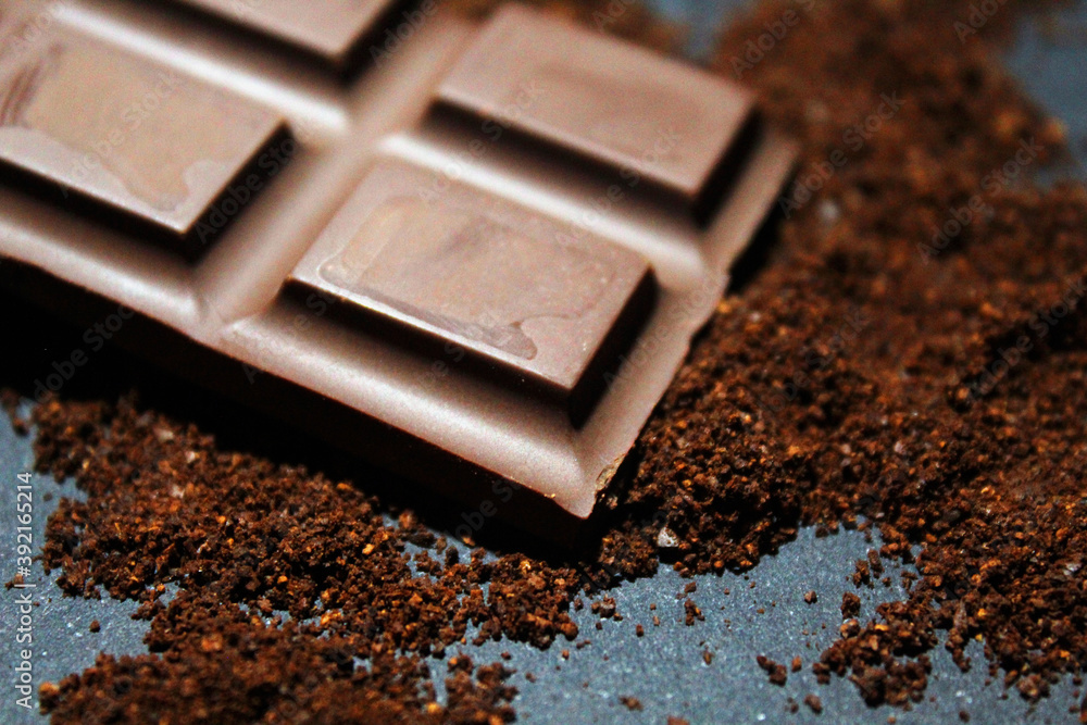 Chocolate bar close up with chocolate powder Chocolate bar close up with chocolate powder