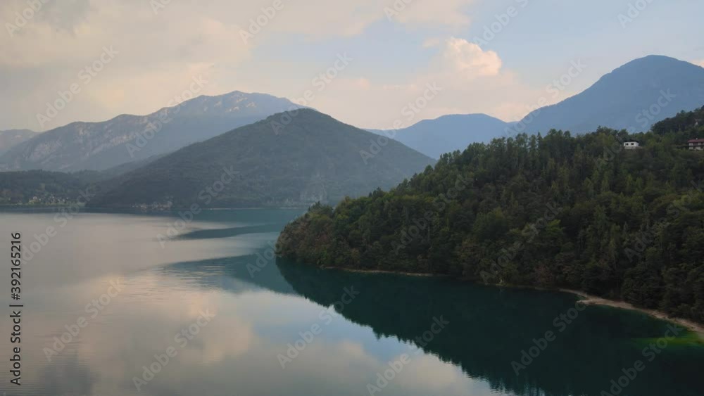 Stunning sight of an overflowing turquoise and crystal clear lake ledro in trentino, north italy Stunning sight of an overflowing turquoise and crystal clear lake ledro in trentino, north italy