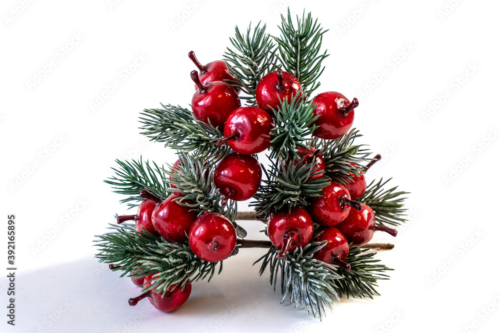 Christmas shiny twigs with berries and nuts, ornament for a Christmas tree, holiday decorations isolated on white background Christmas shiny twigs with berries and nuts, ornament for a Christmas tree, holiday decorations isolated on white background