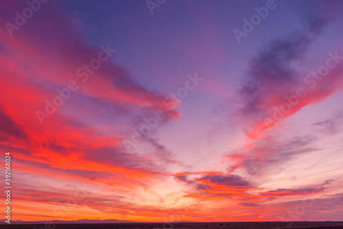 Beautiful picture of a sunset in a partial cloudy day with purple and orange colors. Great dawn © Rodrigo_Fernandez_Ph