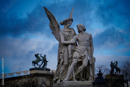 Wallpaper Mural Nike Goddes of greek mythology helping a fallen soldier in with a blue sky in nightfall. Berlin Germany     Torontodigital.ca