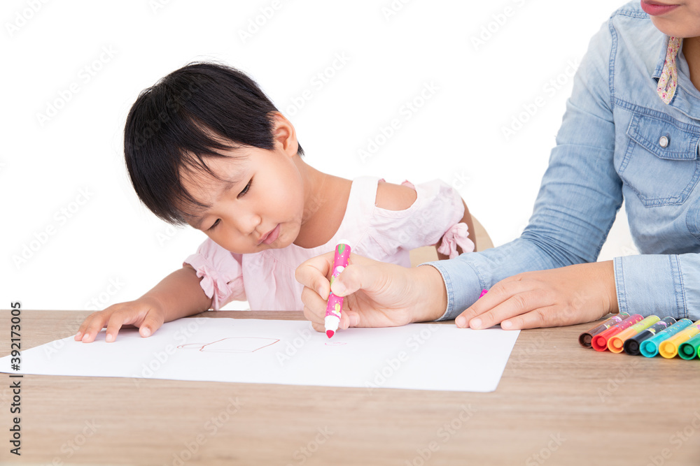 Young mother or preschool teacher patiently teaching children to draw Young mother or preschool teacher patiently teaching children to draw