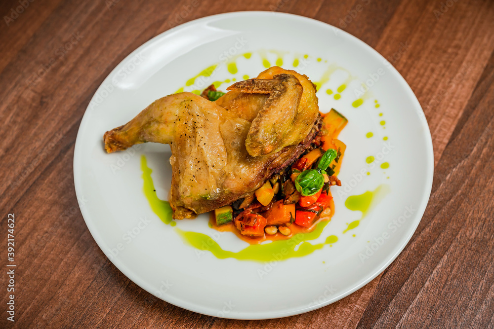 Half of the chicken with vegetable caponata Half of the chicken with vegetable caponata