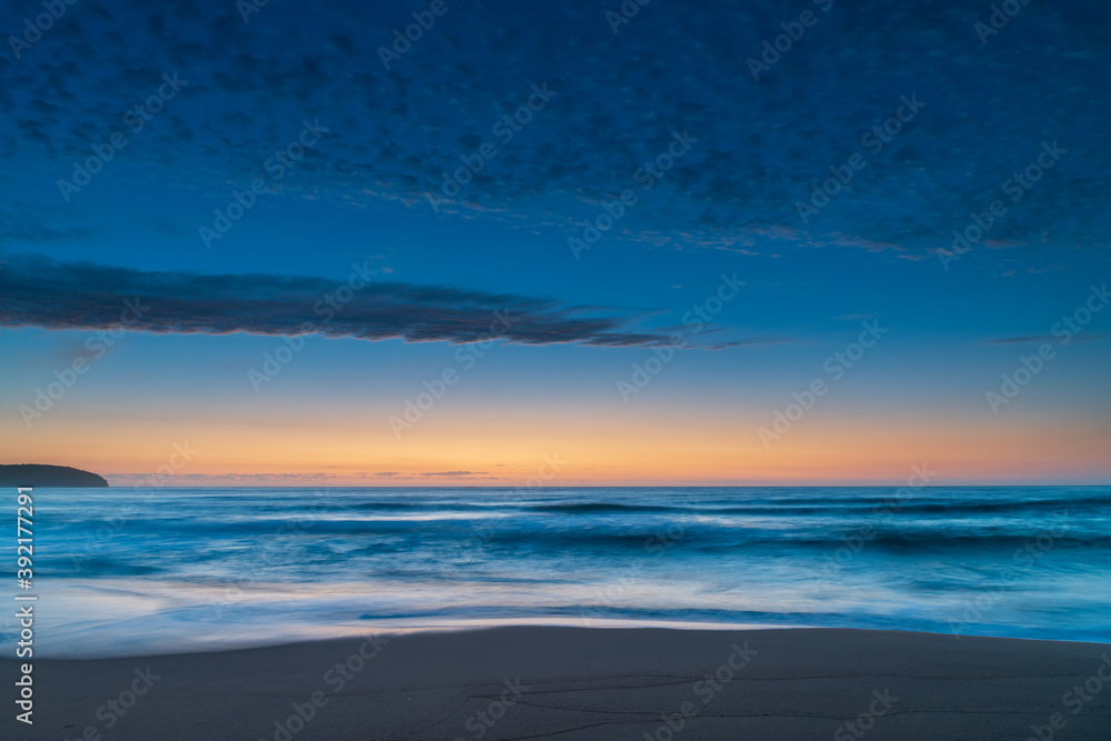 High cloud, partial moon and a pretty blue dawn at the beach