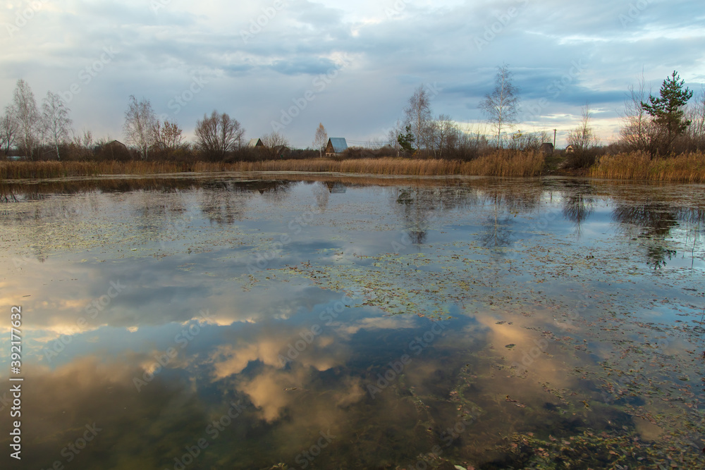 Clouds in the sky with reflection in the lake at sunset. Clouds in the sky with reflection in the lake at sunset.