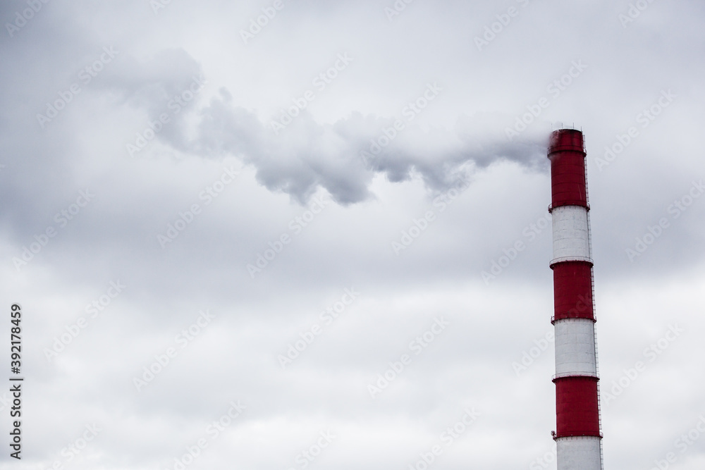 steam smoke from an industrial red-white pipe steam smoke from an industrial red-white pipe